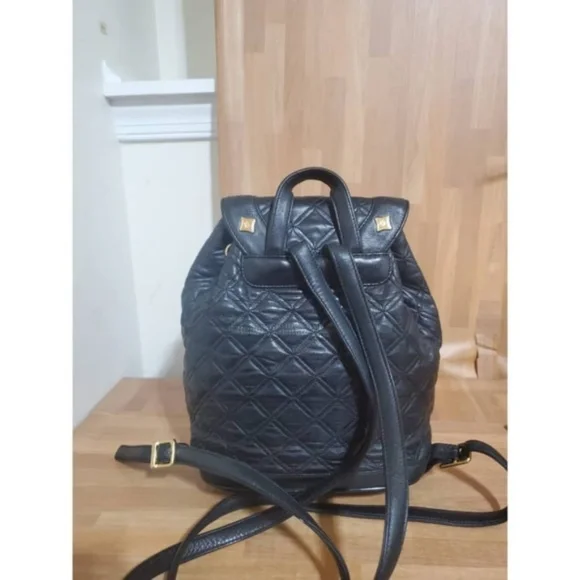 Authentic MCM Black Quilted Leather Stark Gold Embellished 